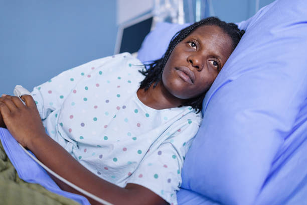 Close-up of a black female patient lying in the hospital bed Close-up of a black female patient lying in the hospital bed